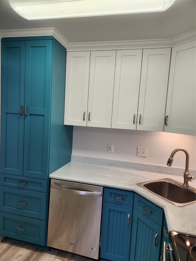 kitchen with light hardwood / wood-style flooring, white cabinets, dishwasher, and sink