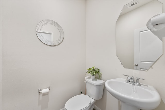 bathroom with sink and toilet