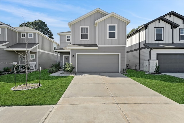 view of front facade with a garage and a front lawn