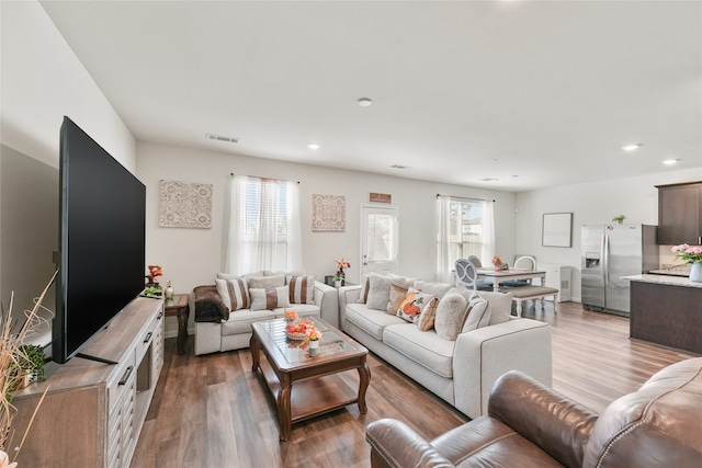 living room with light hardwood / wood-style flooring