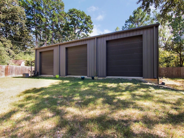 garage featuring a yard