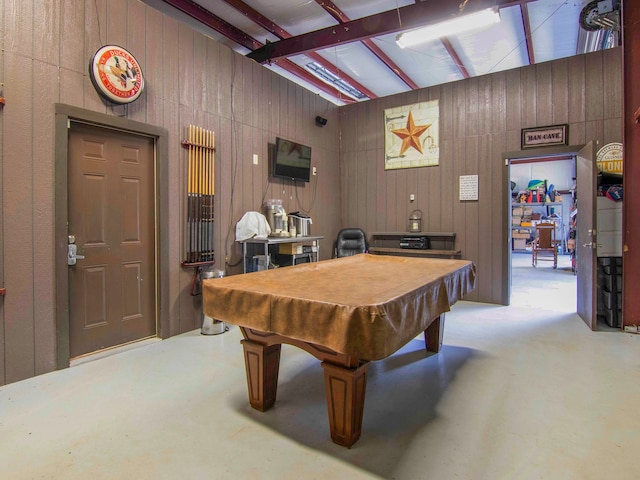 rec room with pool table, beam ceiling, and wooden walls