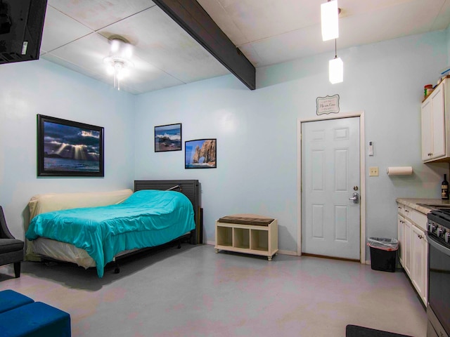 bedroom featuring ceiling fan and beamed ceiling