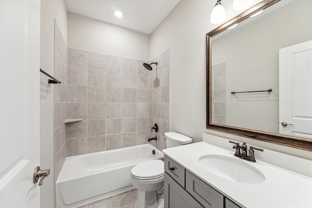 full bathroom with tiled shower / bath combo, vanity, and toilet