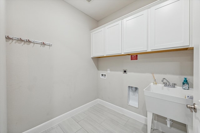 laundry area featuring cabinets, hookup for an electric dryer, and hookup for a washing machine