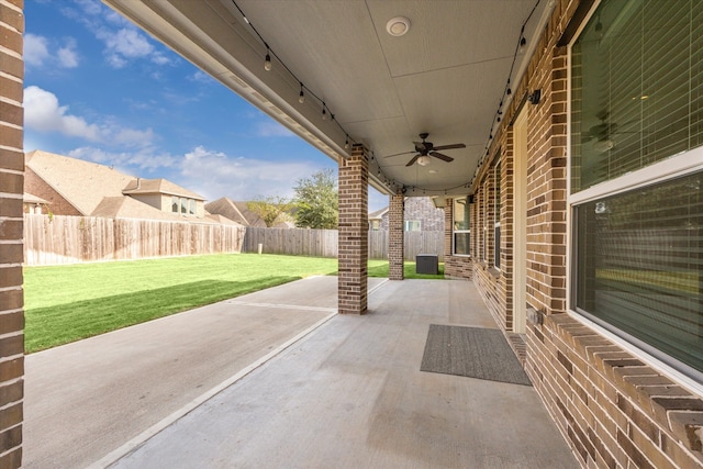 view of patio / terrace featuring ceiling fan and central AC