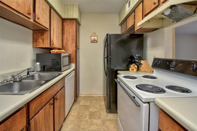 kitchen featuring white appliances and sink