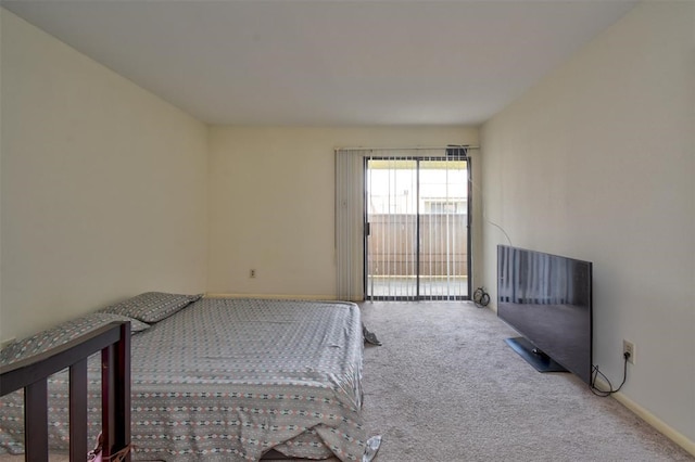 unfurnished bedroom with access to outside and carpet