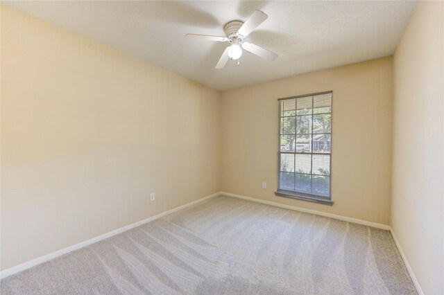 unfurnished room featuring carpet and ceiling fan