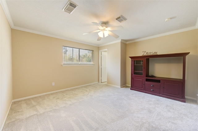 unfurnished living room with light carpet, ceiling fan, and ornamental molding