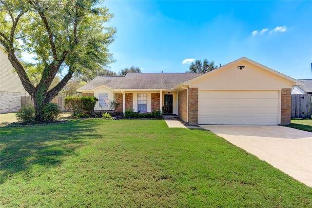 ranch-style home with a front yard and a garage