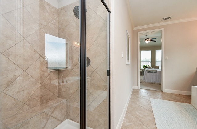 bathroom with crown molding, ceiling fan, and an enclosed shower