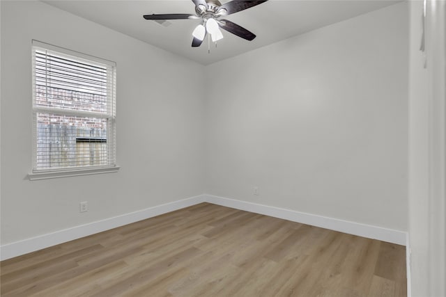 unfurnished room featuring light hardwood / wood-style floors and ceiling fan