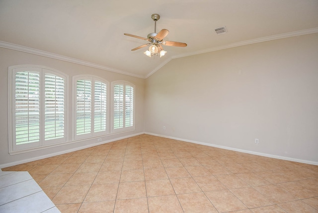 spare room with ornamental molding, vaulted ceiling, and light tile patterned floors