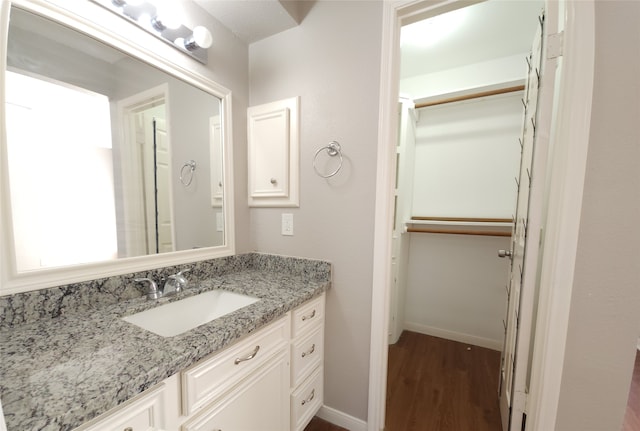 bathroom featuring vanity and hardwood / wood-style floors