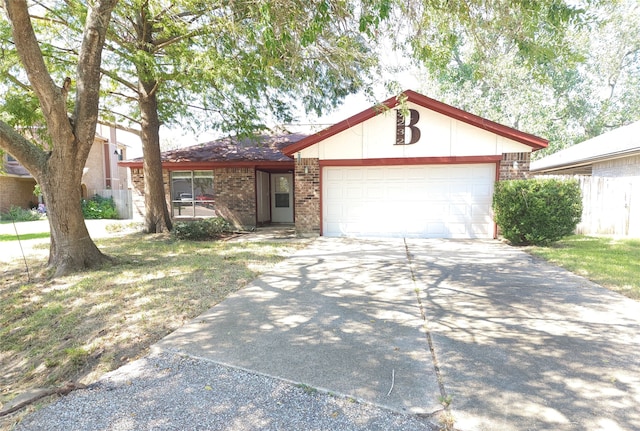 ranch-style house featuring a garage