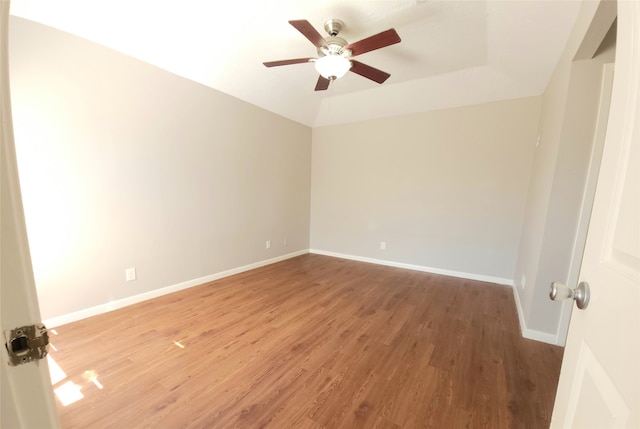 empty room featuring ceiling fan and hardwood / wood-style floors