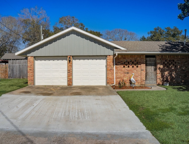 ranch-style home featuring a front yard and a garage