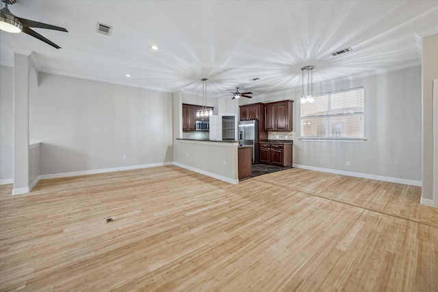 unfurnished living room featuring crown molding, ceiling fan with notable chandelier, and light hardwood / wood-style flooring