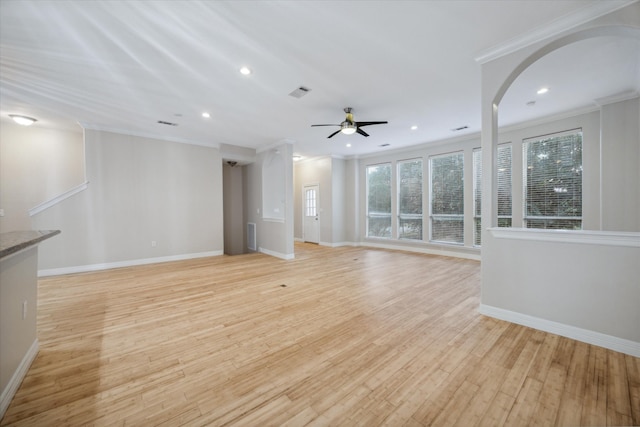 unfurnished living room featuring light hardwood / wood-style floors, ceiling fan, and crown molding