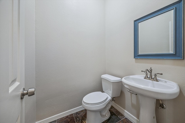 bathroom with toilet and sink