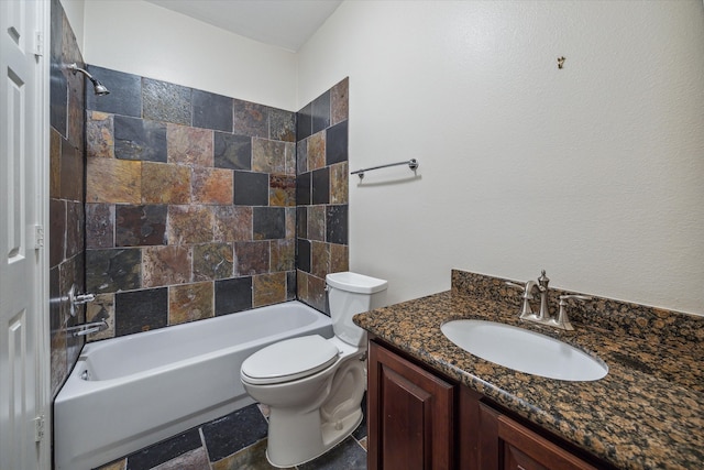 full bathroom with vanity, tiled shower / bath combo, and toilet