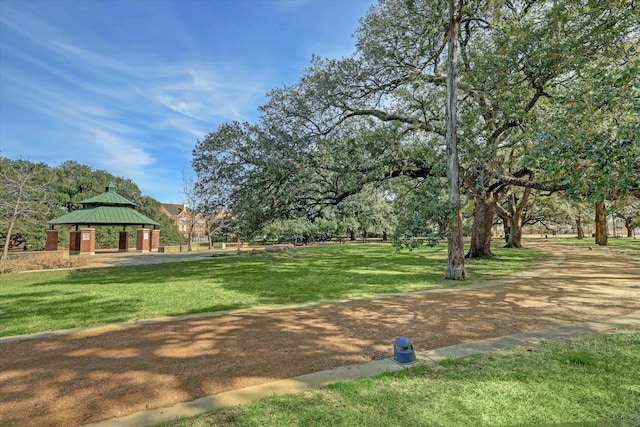 view of property's community with a gazebo and a yard