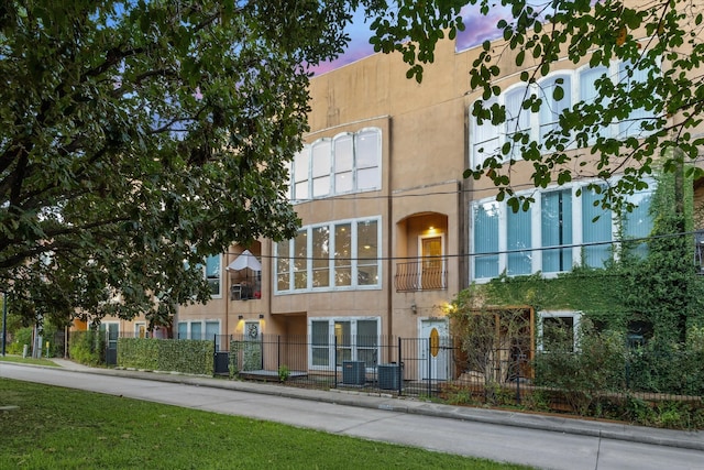 view of outdoor building at dusk