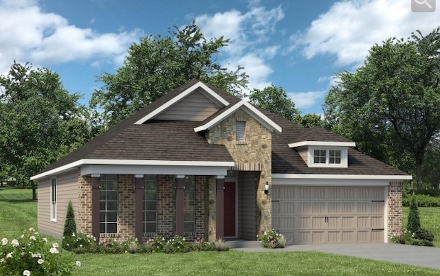 view of front of home featuring a garage and a front lawn