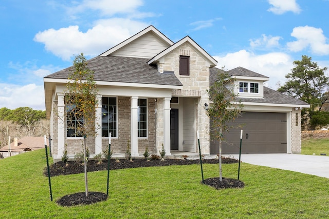 view of front of home with a garage and a front yard