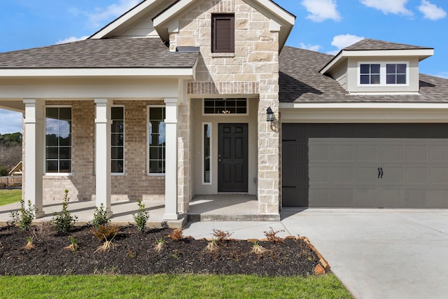 view of front of home featuring a garage and covered porch