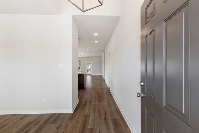 hallway with dark hardwood / wood-style floors