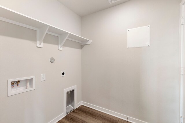 laundry room featuring electric dryer hookup, hookup for a washing machine, and dark hardwood / wood-style floors