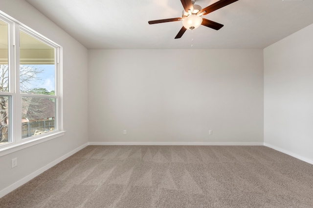 unfurnished room featuring ceiling fan and carpet floors