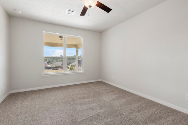 spare room with carpet flooring and ceiling fan