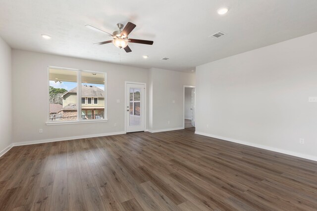 unfurnished living room with ceiling fan and dark hardwood / wood-style floors