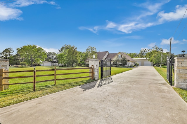 exterior space with a garage and a front lawn