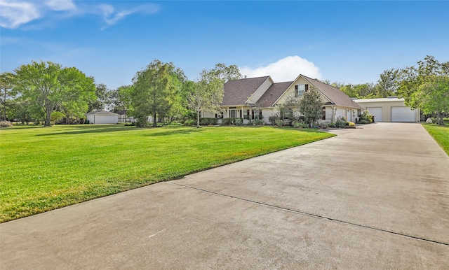 view of front of property featuring a front lawn and a garage