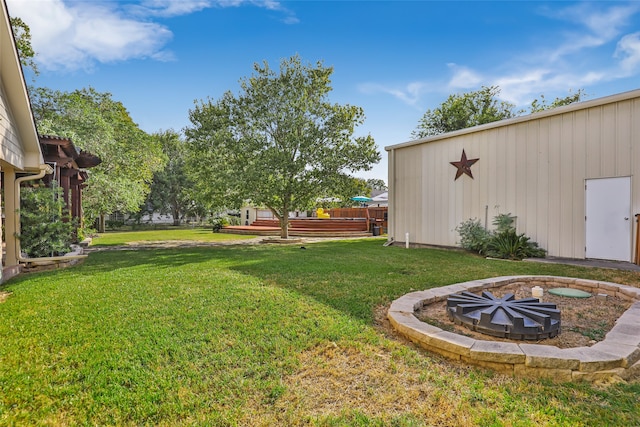 view of yard featuring a fire pit