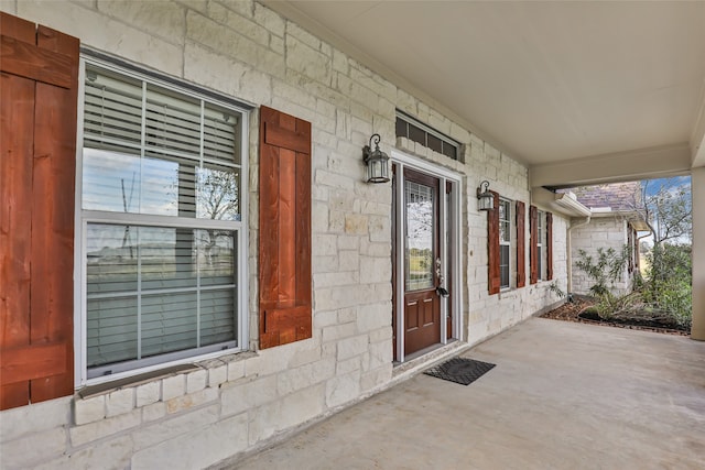 doorway to property featuring covered porch