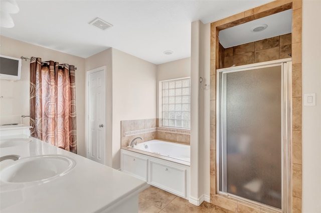 bathroom featuring shower with separate bathtub, tile patterned floors, and sink