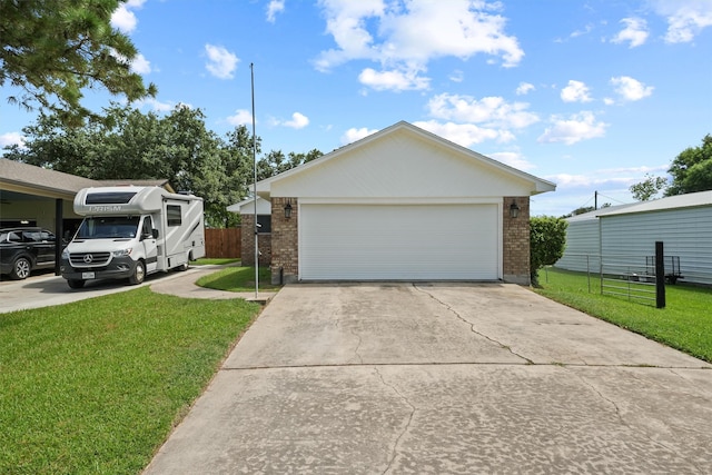 view of front of house with a front yard and a garage