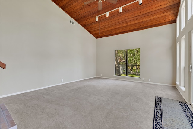 empty room with ceiling fan, carpet floors, wood ceiling, and high vaulted ceiling