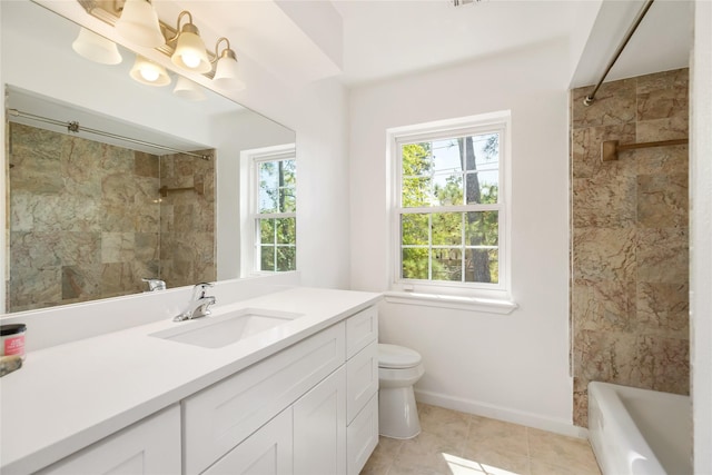 full bathroom with vanity, tile patterned flooring, tiled shower / bath combo, and toilet