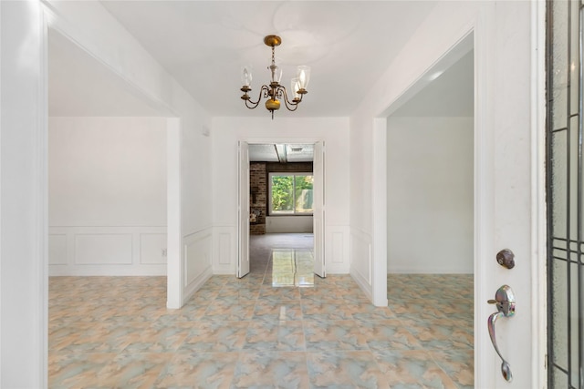 entryway with an inviting chandelier