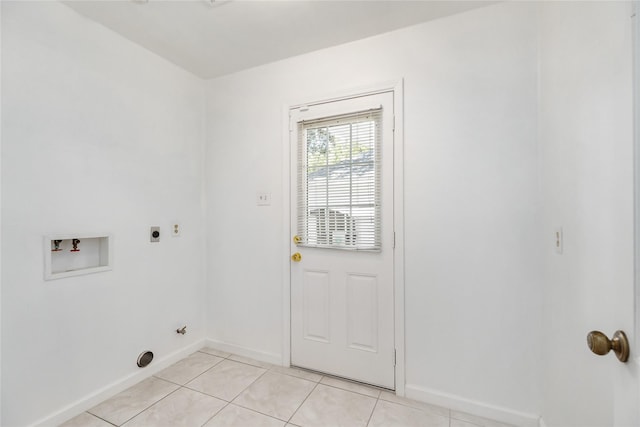 laundry room featuring hookup for a washing machine, light tile patterned flooring, and hookup for an electric dryer