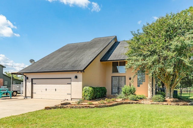 view of front facade featuring a front yard and a garage