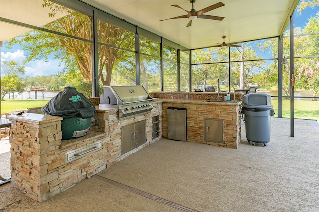 sunroom with sink, a healthy amount of sunlight, and ceiling fan