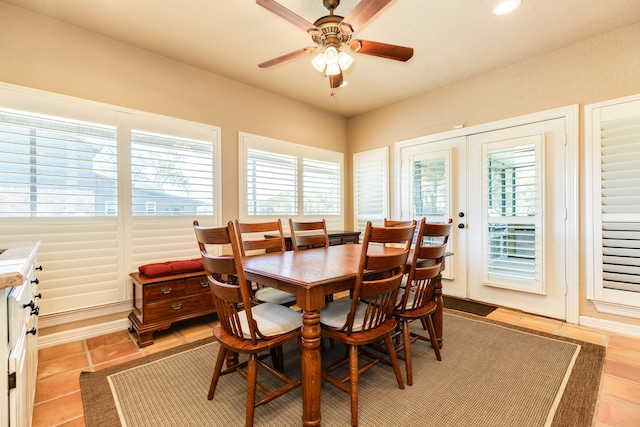 tiled dining space with french doors and ceiling fan