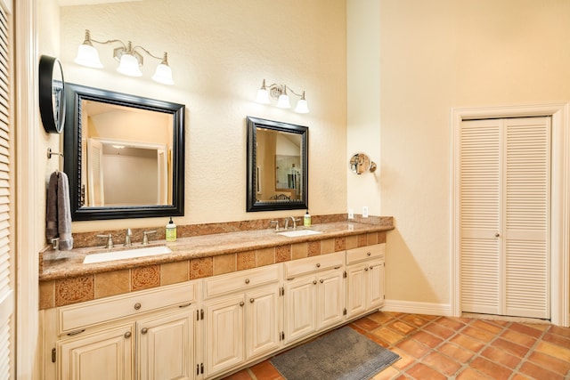 bathroom with vanity and tile patterned flooring